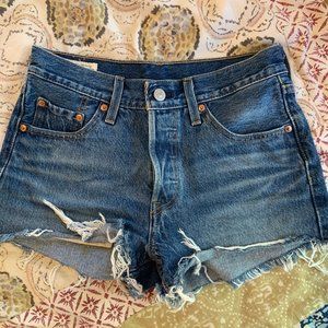 High-waisted cheeky dark wash Levi cutoff shorts